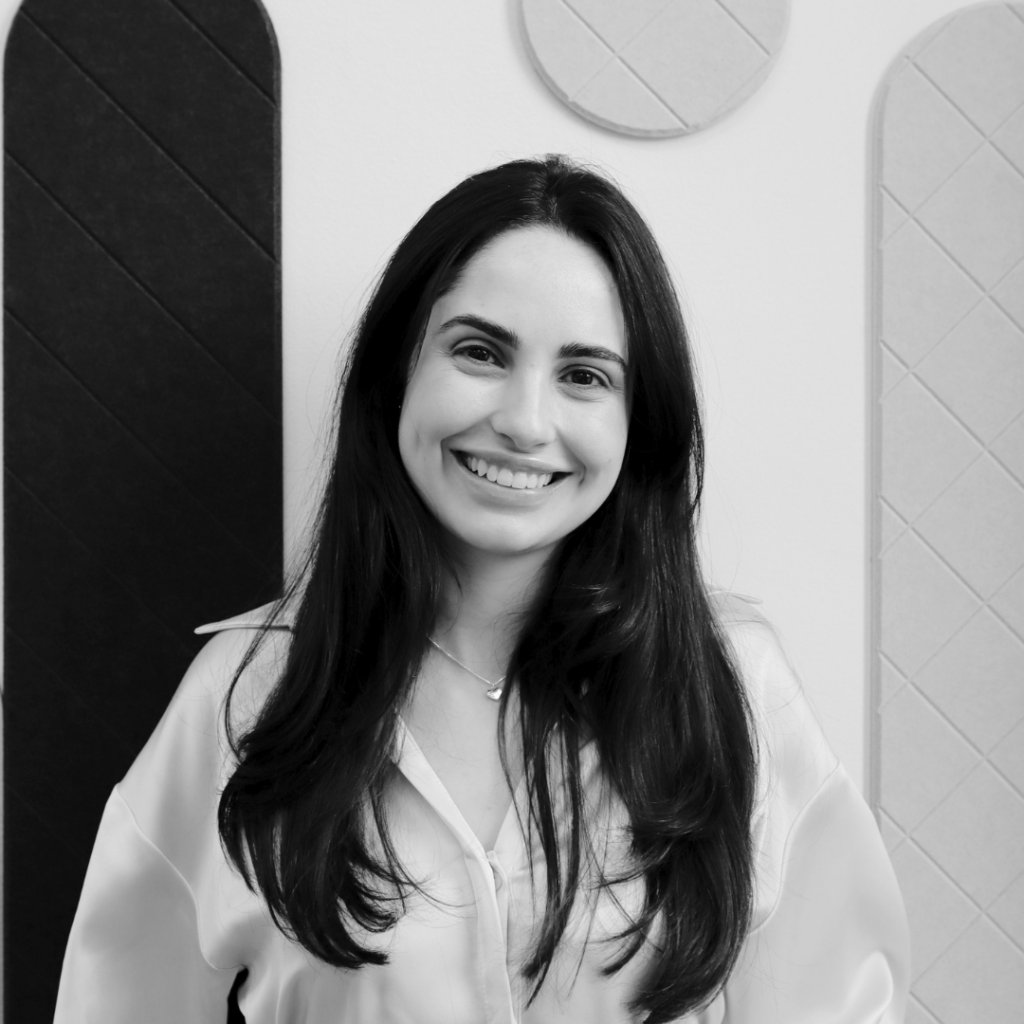A black & white headshot photo of Ana Carolina Rocha, the Architectural Technologist Team Manager at MOY.